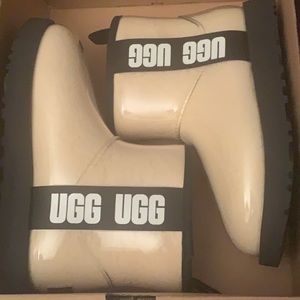 Clear and black UGG boots
